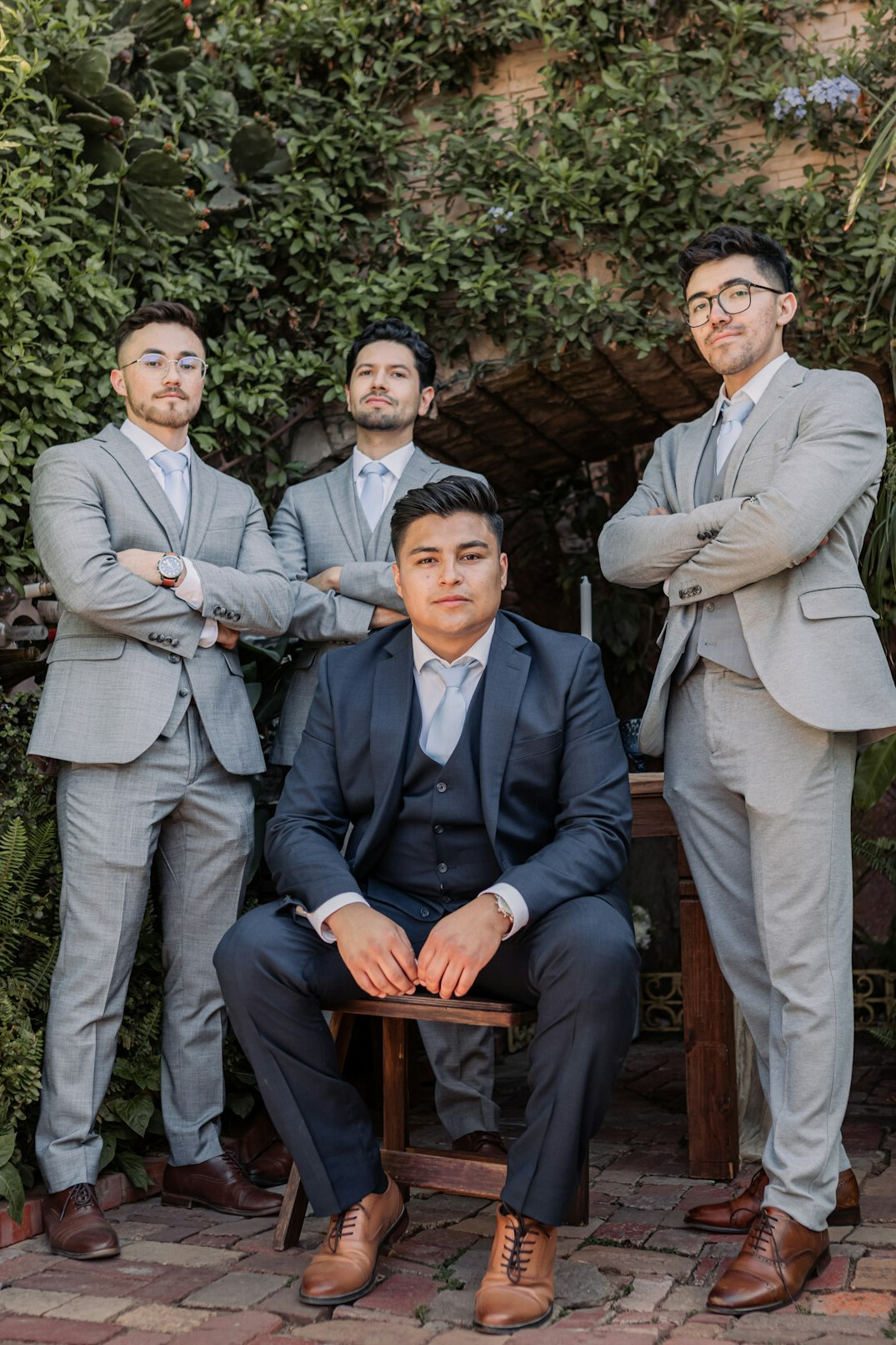 Group portrait of four real estate professionals in business attire